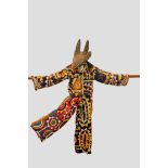 Nigerian ceremonial cotton and felt appliqué patchwork child’s dance costume with carved wood animal