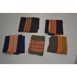 Four Laos women’s skirts, all woven with traditional colourful bands; two black cotton(?) and two