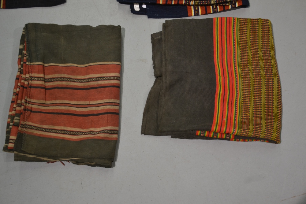 Four Laos women’s skirts, all woven with traditional colourful bands; two black cotton(?) and two - Image 2 of 4