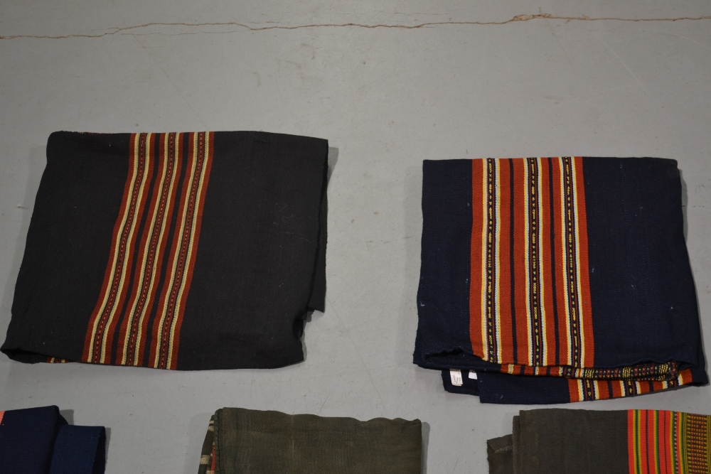 Four Laos women’s skirts, all woven with traditional colourful bands; two black cotton(?) and two - Image 3 of 4