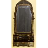 A Queen Anne style black lacquer decorated swing toilet mirror, the bevelled glass with a fret