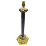 A Victorian table lamp, the black painted brass stem with ormolu foliage capital later fitted for