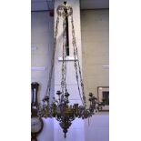 A French Gothic Revival cast brass six branch chandelier with 18 lights, decorated fleur de lis