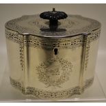 A Victorian oval tea caddy, in late eighteenth century style, serpentine sided with engraved border,