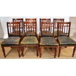 A set of eight Victorian walnut side chairs, with reeded vertical rail backs with carved cross bars,