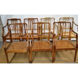 A set of seven Sheraton beech frame elbow chairs (two with original paint), the vertical rail