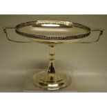 A George V silver two handled tazza, the circular dish top, with a pierced gallery and two lifts,