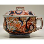 A Japanese porcelain late nineteenth century Imari chamber pot with cover, the side decorated rust