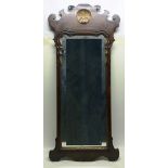 A George II style walnut veneered fret frame pier mirror, the glass in a gilt gesso moulded