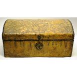 A small antique travelling trunk, covered in embossed leather fruit and foliage with brass nailed