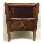 A Sheraton period mahogany bedside night commode the galleried top, the concave front with a tambour