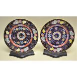 A pair of early nineteenth century Masons Ironstone china plates, decorated coloured foliage to a