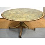 A painted beech centre table, the circular top with simulated marbling with a cream banded border to