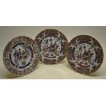 A pair of Chinese Republic famille rose porcelain plates, decorated a mandarin and attendants seated