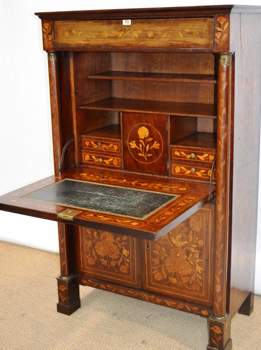 An early nineteenth century Dutch mahogany veneered and floral marquetry inlaid secretaire a