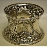 A large Edwardian silver copy of an eighteenth century Irish dish ring, decorated repousse dolphins,