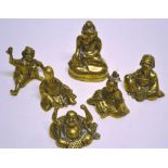 A set of five oriental brass castings of immortals in seated positions. 2.75in (7cm). Together