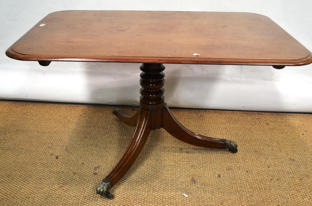 An early nineteenth century mahogany breakfast table, the plumbago figured rectangular top with