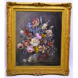 An oil painting on hardboard, still life of flowers on a pedestal. 24in (61cm) x 20in (51cm). A gilt