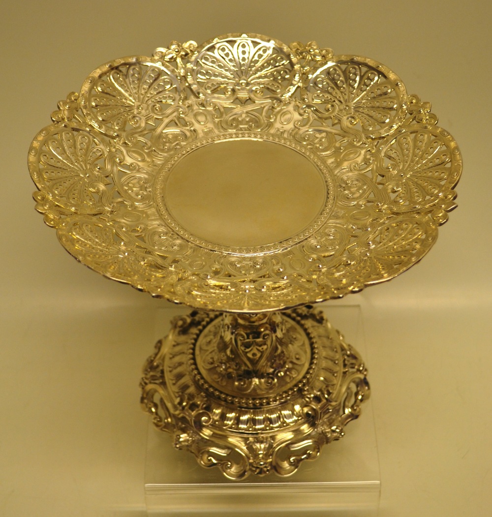 A Victorian silver tazza in English Renaissance style, the chased circular pierced dish on a