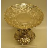 A Victorian silver tazza in English Renaissance style, the chased circular pierced dish on a