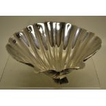 A cast Irish silver scallop shell dish, on three mussel feet. 5.5in (14cm). Makers Royal Irish