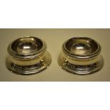 A pair of late Victorian silver copies of Queen Anne circular trencher salts. Maker Messrs Barnard