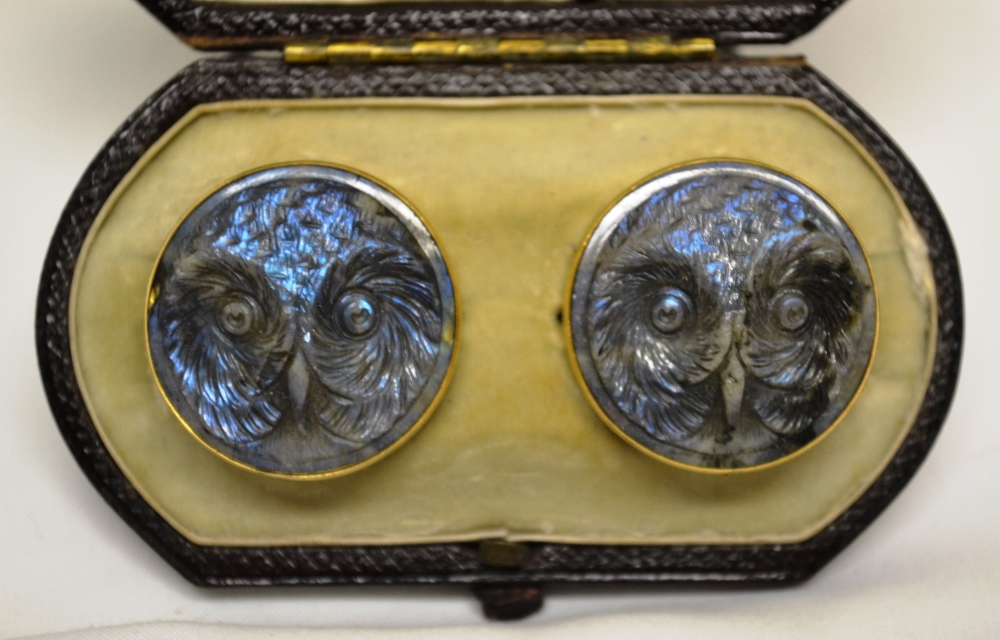 A Victorian Labradorite pair of cloak studs, the circular carved owl faces in plain yellow gold