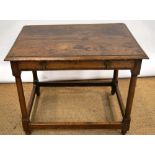 An antique oak side table, fitted a pine lined drawer with brass hammer head handles, on turned