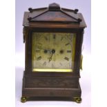 A George IV rosewood veneered table clock, with brass inlay, the 8 day movement with a pull