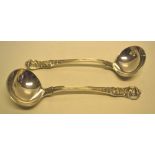 A pair of William IV/early Victorian Queen pattern silver sauce ladles, engraved initials. Maker