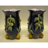 A pair of nineteenth century Majolica vases, decorated raised pendant sprays of blackberries to a