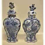 Two eighteenth century Dutch Delft blue and white vases, either decorated a peacock or a basket of