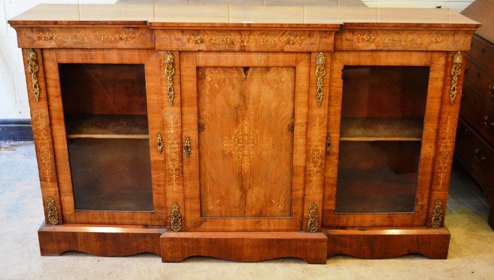 A nineteenth century Franglais walnut veneered breakfront side cabinet, the front inlaid