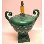 A late Victorian green glazed urn, earthenware table lamp, in Neo classical Revival style, with a