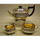 A silver three piece tea service, in Regency style, the rectangular ogee bodies with fine gadroon