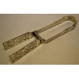 A pair of late Victorian silver Devonshire pattern asparagus tongs, crested. Makers Holland,