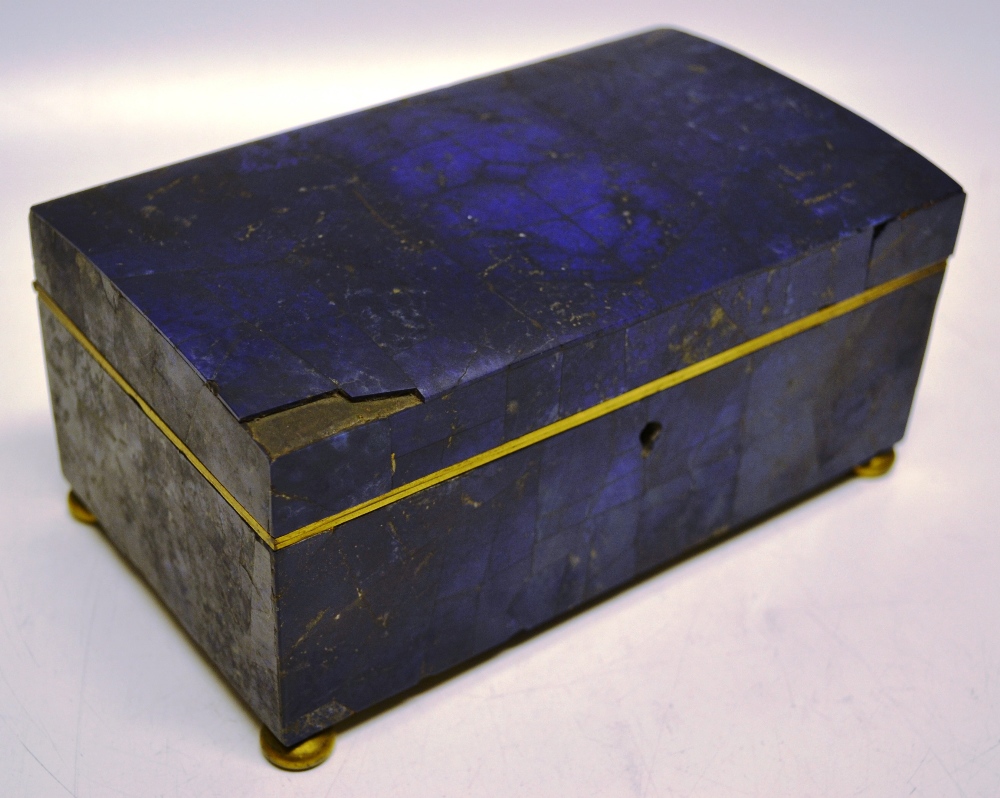A Victorian Lapis- lazuli jewellery box, having a domed lid, gilt metal mounts and bun feet, lined