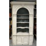 An eighteenth century painted pine corner display unit the moulded dentil cornice with a keystone