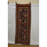 Good Kazak long rug, south west Caucasus, mid-19th century, 8ft. 7in. x 3ft. 3in. 2.62m. x 1m.