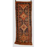 Akstafa long rug, Kazak area, south west Caucasus, early 20th century, 9ft. 10in. x 3ft. 10in. 3m. x
