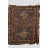 Two rugs, comprising: Caucasian long rug, 7ft. 2in. x 3ft. 10in.2.18m. x 1.17m. And a Khamseh rug,