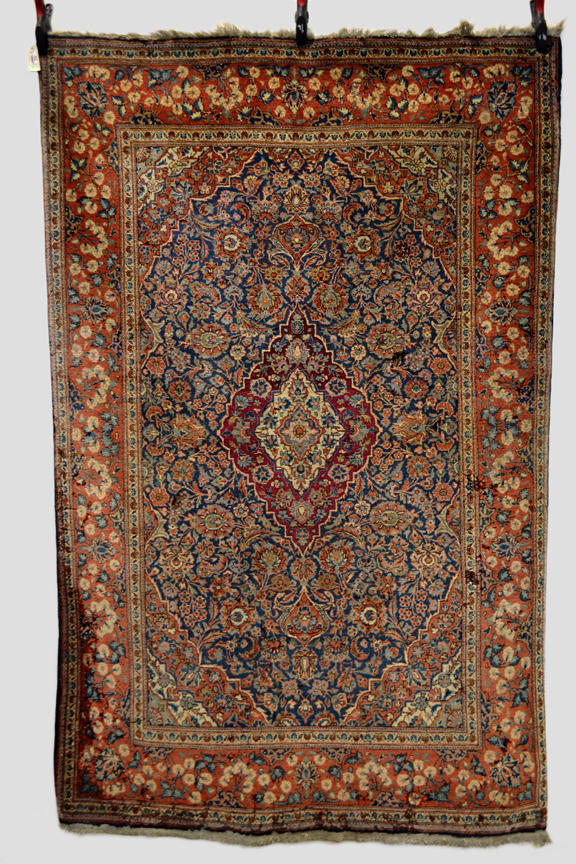 Kashan rug, west Persia, circa 1920s, 6ft. 11in. x 4ft. 6in. 2.11m. x 1.37m. Areas of moth damage,