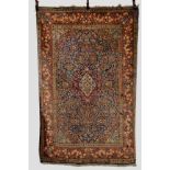 Kashan rug, west Persia, circa 1920s, 6ft. 11in. x 4ft. 6in. 2.11m. x 1.37m. Areas of moth damage,