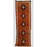 North west Persian runner, circa 1930s, 9ft. 7in. x 3ft. 1in. 2.92m. x 0.94m. Some wear in places;