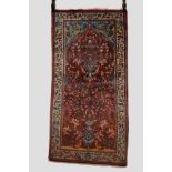 Saruk prayer rug, north west Persia, mid-20th century, 4ft. 7in. x 2ft. 3in. 1.40m. x 0.69m. Vase of