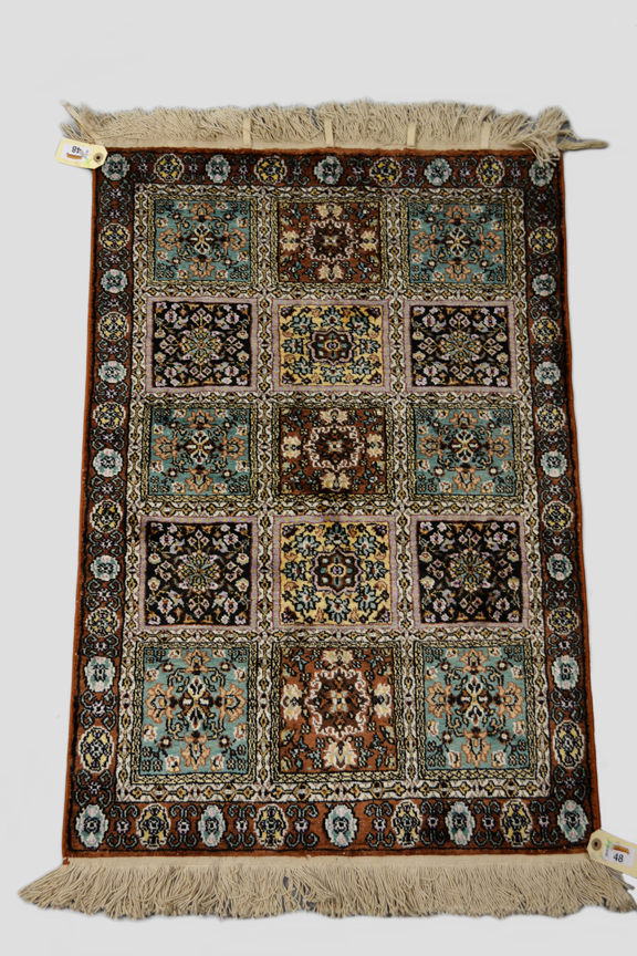 Kashmiri silk rug of panelled floral design, north India, second half 20th century, 3ft. x 2ft. 0.