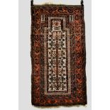 Baluchi ivory field prayer rug, Khorasan, north east Persia, early 20th century, 5ft. 2in. x 2ft.