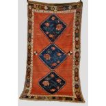 Karabakh triple medallion long rug, dated 1916 several times in various scripts in the red field,
