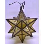 An amber tinted glass pointed star hall light. 16in (41cm). (1930's).